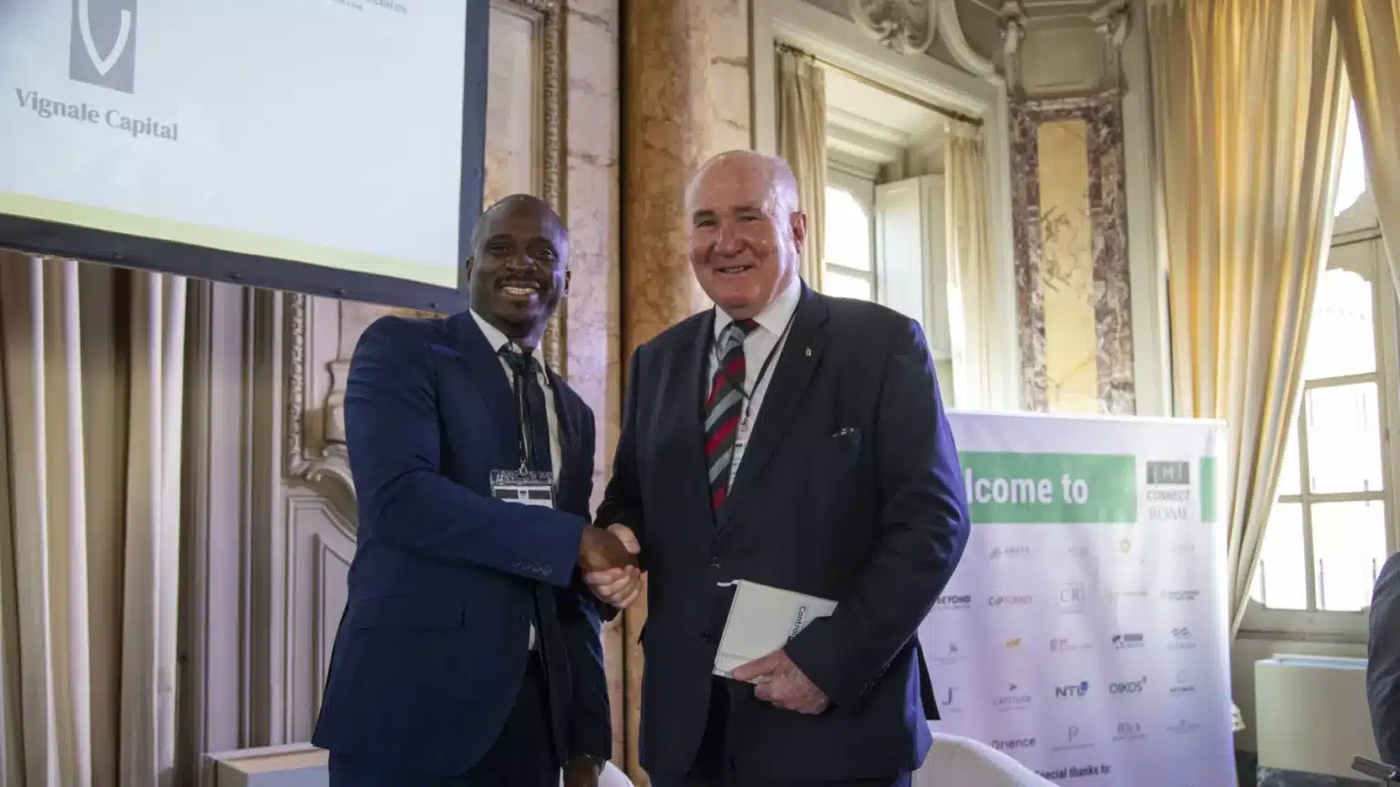 Richard Moir during a professional business meeting and handshake.